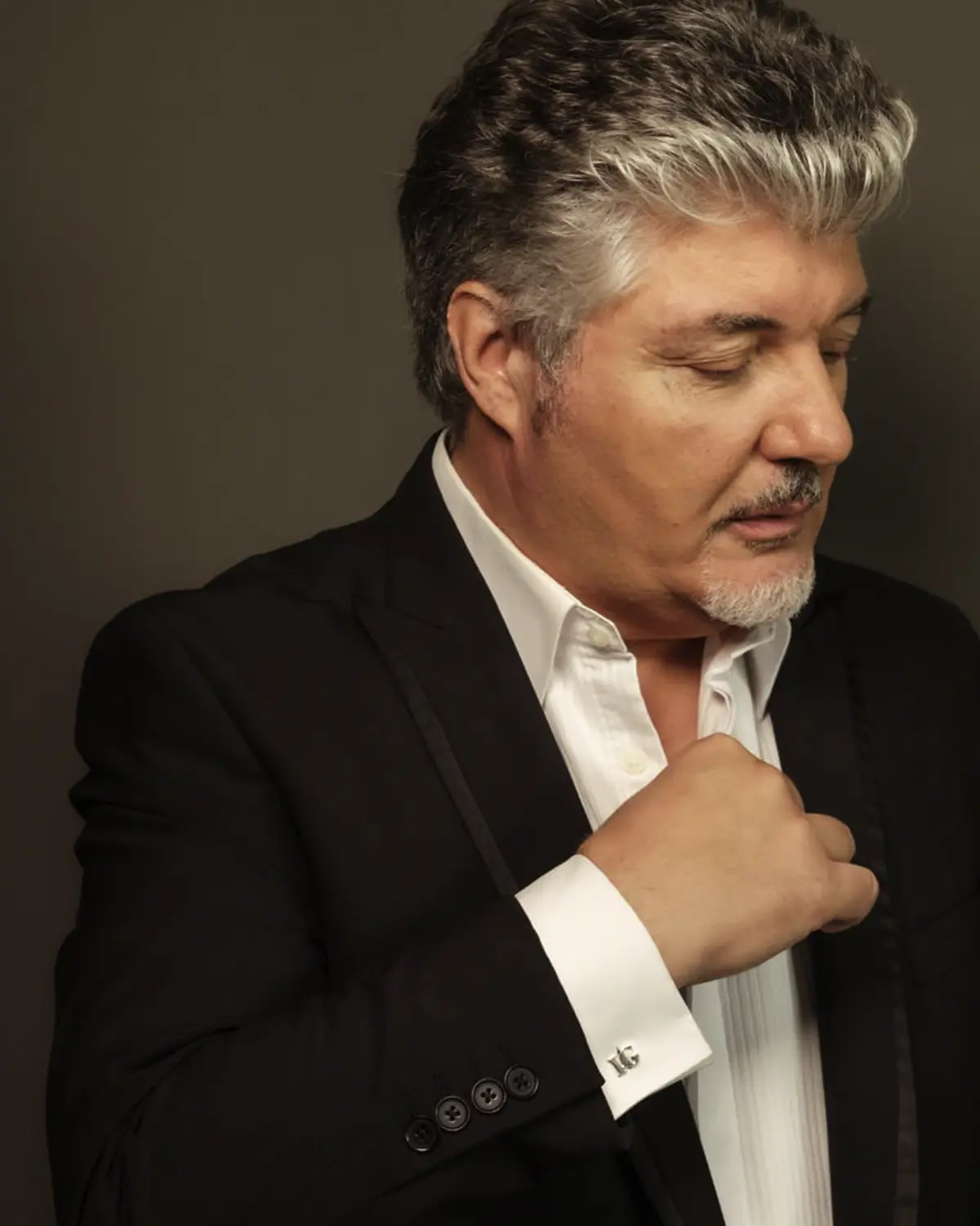 Ivan Grech — promotional portrait beside a doorway, warm tones and grayscale split